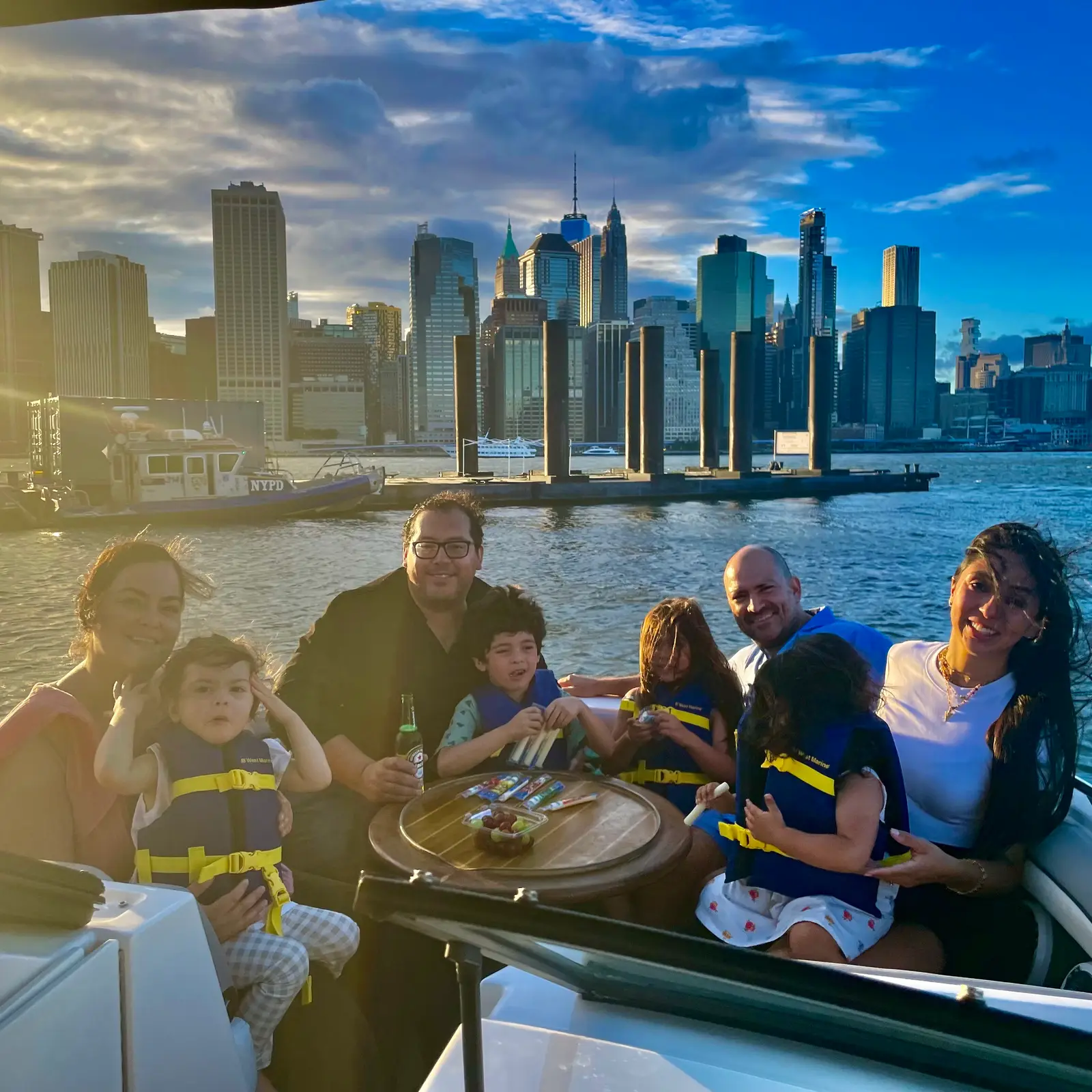 Guests posing with the Statue of Liberty behind them on a New York Charters trip