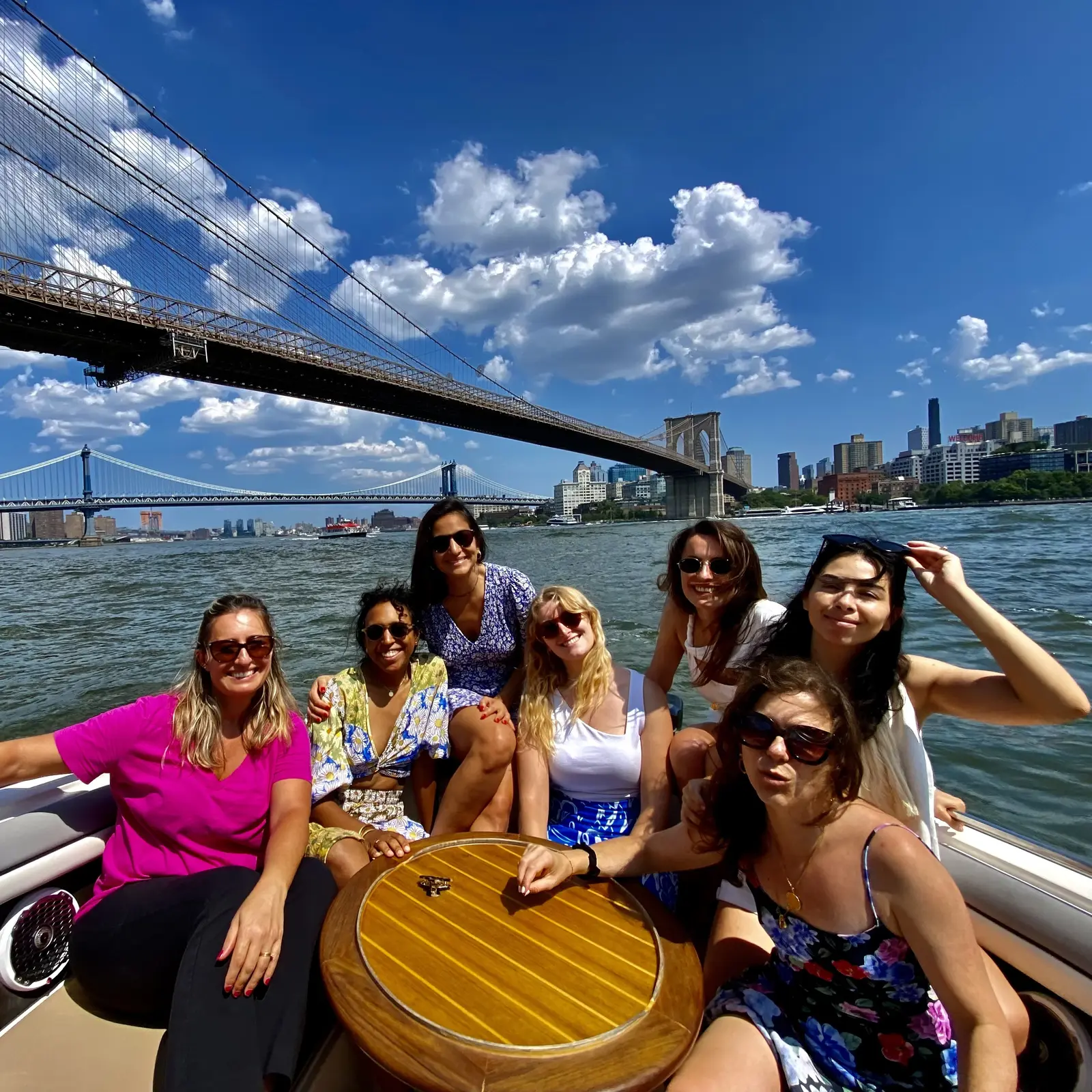 Guests watching the sunset skyline during a river tour